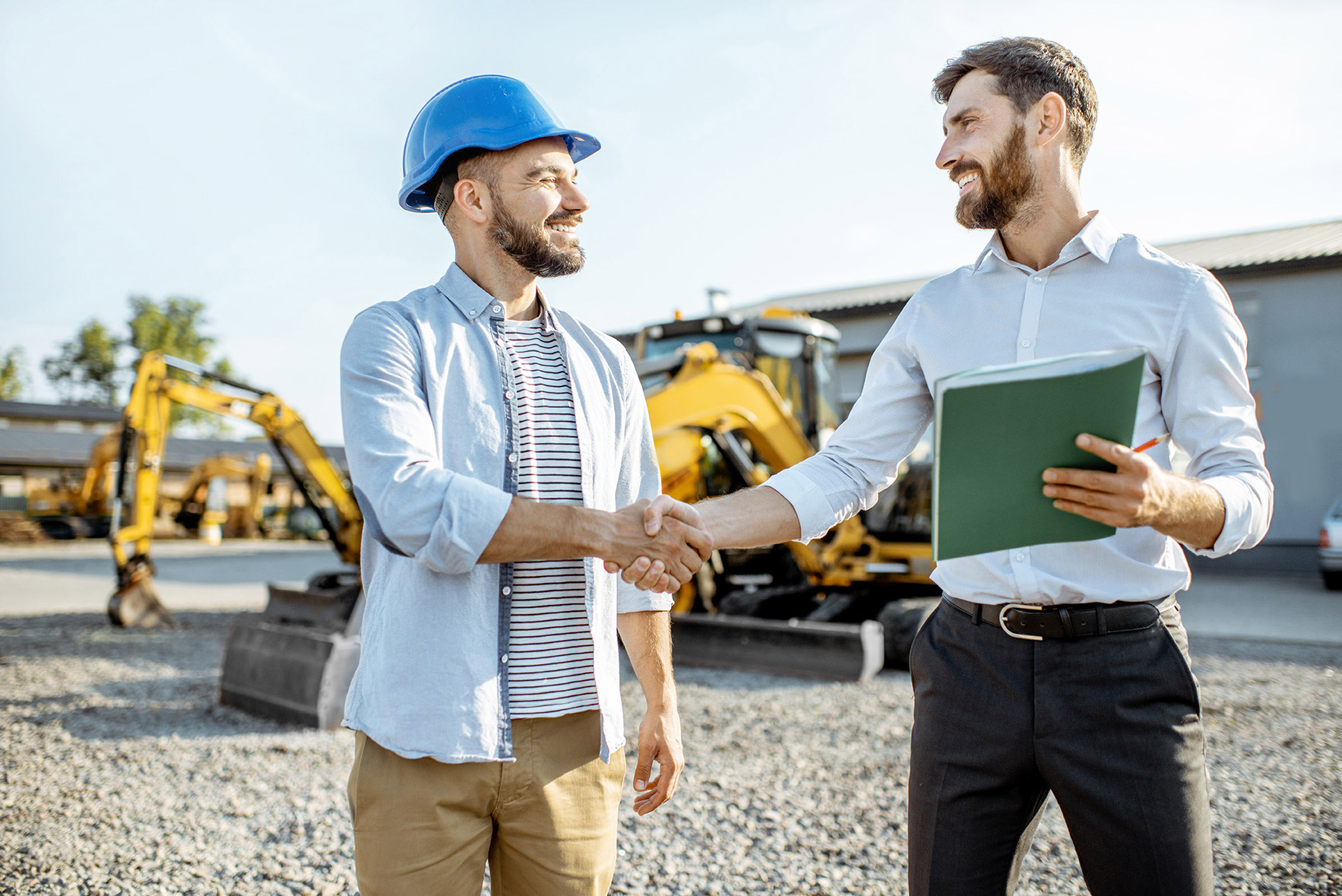 men shaking hands outside