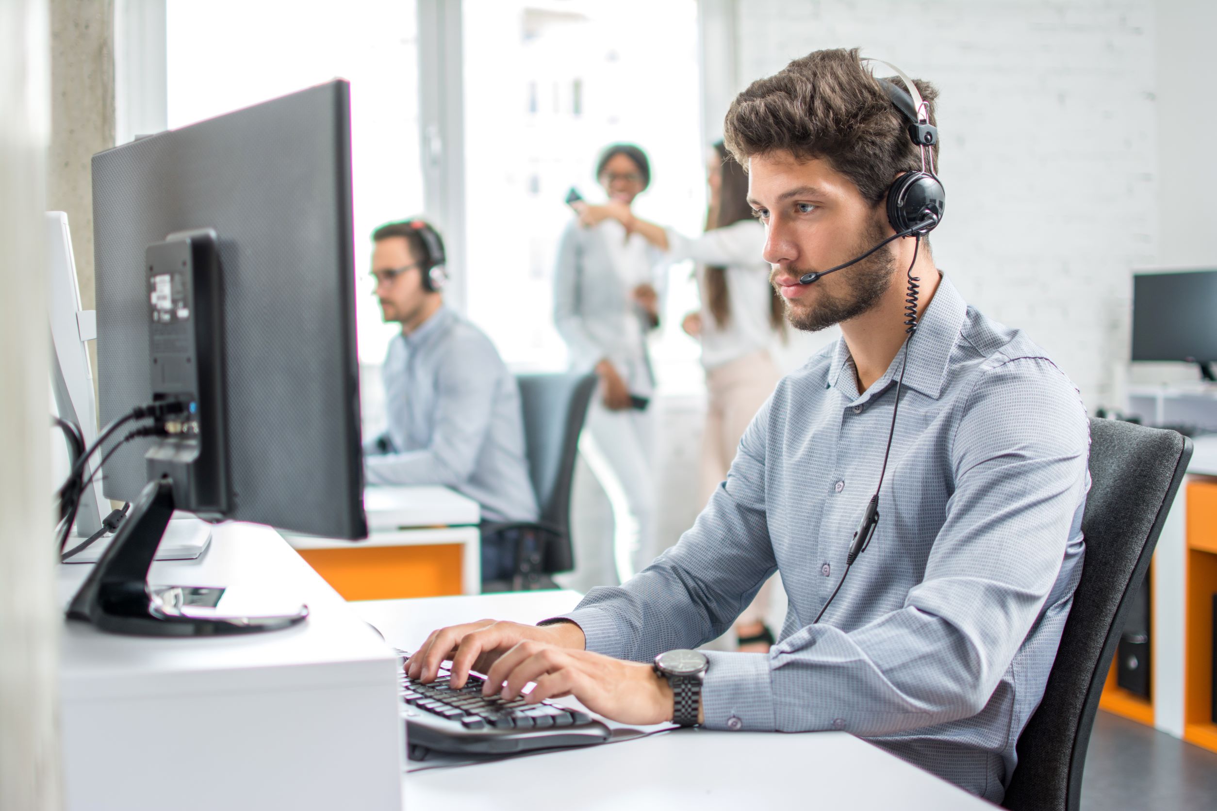 Collections agent working from a desk performing a rent recovery service