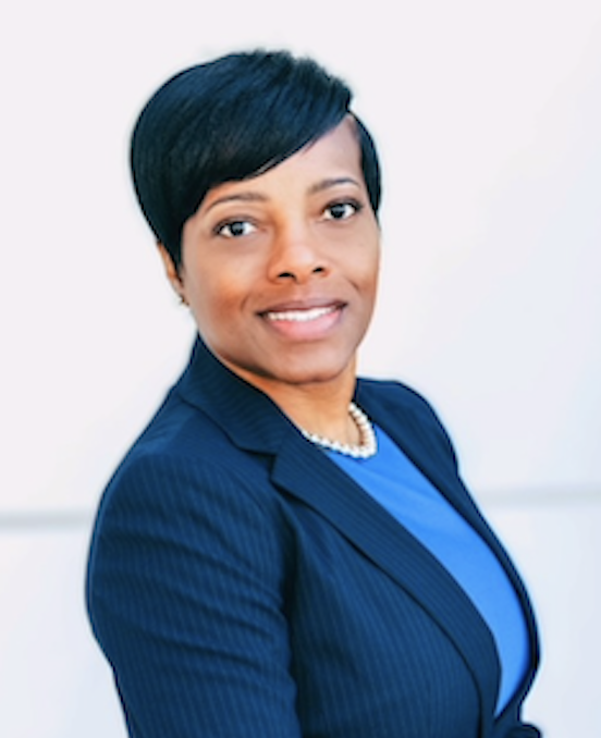 Alecia Bailey, Assurant's Global Head of Diversity, Equity & Inclusion posing for the camera in a blue suit