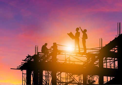 a group of people working on a structure